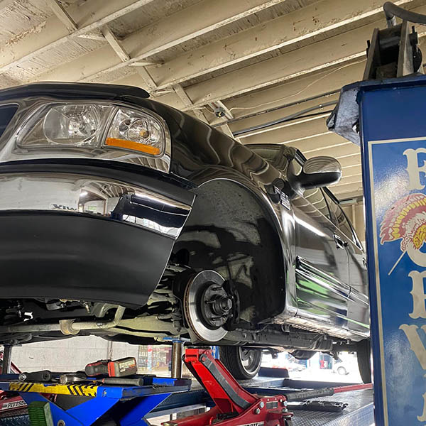 car on jacks being repaired